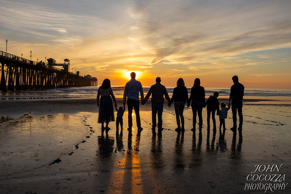 family pictures at oceanside pier by san diego photographer john cocozza